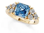 Fancy Blue Asscher Cut Diamond Solitaire Ring Set in Yellow gold with Cluster Accents on Each Side