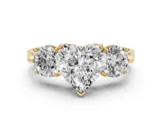 Heart Cut Diamond Three-Stone Ring Set in Yellow gold with Milgrain Band