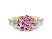 Fancy Pink Round Cut Diamond Three-Stone Ring Set in Yellow gold with Pavé Band and Graduated Sides