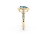 Fancy Blue Pear Cut Diamond Halo Pavé Engagement Ring Set in Yellow gold with Bezel Setting