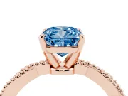 Fancy Blue Cushion Cut Diamond Solitaire Ring Set in Rose gold with Twisted Band and Bead Prong Setting