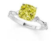 Fancy Yellow Cushion Cut Diamond Solitaire Ring Set in White gold with Bezel Set Side Stones and Prong Setting