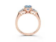 Fancy Blue Three-Stone Oval Cut Diamond Ring Set in Rose gold with Pear Side Stones and Prong Setting