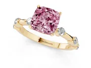 Fancy Pink Cushion Cut Diamond Solitaire Ring Set in Yellow gold with Bezel Set Side Stones and Prong Setting