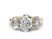 Oval Cut Diamond Three-Stone Ring Set in Yellow gold with Bold Center and Classic Band