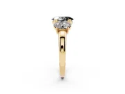 Fancy Black Oval Cut Diamond Three-Stone Ring Set in Yellow gold with Polished Band and Prong Setting