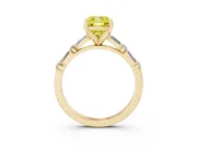 Fancy Yellow Cushion Cut Diamond Solitaire Set in Yellow gold with Side Baguettes and Channel Set Band