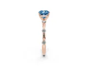 Fancy Blue Cushion Cut Diamond Solitaire Ring Set in Rose gold with Bezel Set Side Stones and Prong Setting