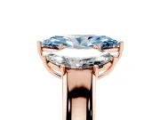 Fancy Blue Three-Stone Marquise Cut Diamond Ring Set in Rose gold with Matching Prong Settings and Plain Band