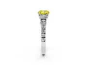 Fancy Yellow Cushion Cut Diamond Three-Stone Ring Set in Silver with Round Side Stones and Delicate Pavé Band