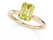 Fancy Yellow Emerald Cut Diamond Solitaire Ring Set in Yellow gold with Prong Setting on a Polished Plain Band