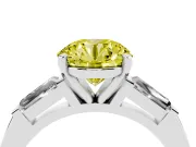 Fancy Yellow Round Cut Diamond Solitaire Ring Set in Platinum with Tapered Baguette Side Stones and Prong Setting