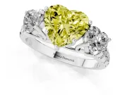 Fancy Yellow Heart Cut Diamond Three-Stone Ring Set in Platinum with Pavé Band