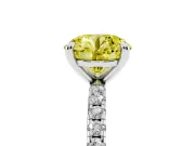 Fancy Yellow Round Cut Diamond Brilliant Solitaire Ring Set in White gold with Pavé Band and Prong Setting