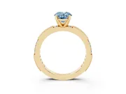 Fancy Blue Oval Cut Diamond Solitaire Ring Set in Yellow gold with Slim Pavé Band and Prong Setting