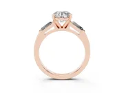 Round Cut Diamond Solitaire Ring Set in Rose gold with Tapered Baguette Side Stones and Prong Setting