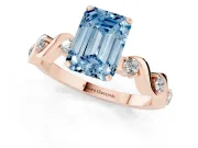 Fancy Blue Emerald Cut Diamond Solitaire Ring Set in Rose gold with Ribbon Twist Band, Round Accents and Prong Setting