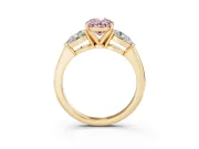 Fancy Pink Three-Stone Oval Cut Diamond Ring Set in Yellow gold with Pear Side Stones and Prong Setting