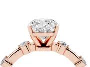 Cushion Cut Diamond Solitaire Ring Set in Rose gold with Bezel Set Side Stones and Prong Setting