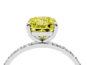 Fancy Yellow Radiant Cut Diamond Solitaire Ring Set in Platinum with Round Pavé Band and Prong Setting