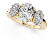 Oval Cut Diamond Three-Stone Ring Set in Yellow gold with Polished Band and Prong Setting