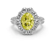 Fancy Yellow Oval Cut Diamond Halo Engagement Ring Set in Silver with Split Shank and Prong Setting