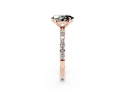 Fancy Black Oval Cut Diamond Solitaire Ring Set in Rose gold with Round Pavé Band and Prong Setting