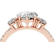 Heart Cut Diamond Three-Stone Ring Set in Rose gold with Pavé Band and Graduated Sides