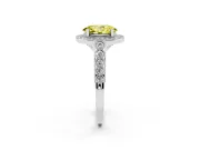 Fancy Yellow Oval Cut Diamond Milgrain Halo Solitaire Ring Set in White gold with Bezel Set Side Stones and Pavé Band
