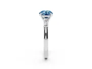 Fancy Blue Round Cut Diamond Solitaire Ring Set in Platinum with Tapered Baguette Side Stones and Prong Setting