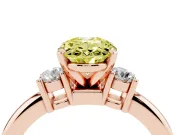 Fancy Yellow Three-Stone Oval Cut Diamond Ring Set in Rose gold with Prong Setting and Plain Band
