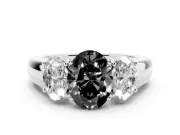 Fancy Black Three-Stone Oval Cut Diamond Ring Set in Silver with Matching Prong Settings and Plain Band