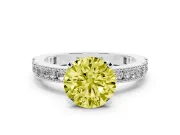 Fancy Yellow Round Cut Diamond Solitaire Ring Set in White gold with Slim Pavé Band and Prong Setting