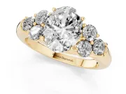 Oval Cut Diamond Cluster Ring Set in Yellow gold with Round Accent Stones and Prong Setting on a Plain Band