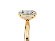Emerald Cut Diamond Solitaire Ring Set in Yellow gold with Prong Setting on a Polished Plain Band