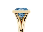 Fancy Blue Bezel Set Princess Cut Diamond Solitaire Ring Set in Yellow gold with Tapered Band