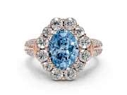 Fancy Blue Oval Cut Diamond Halo Engagement Ring Set in Rose gold with Split Shank and Prong Setting