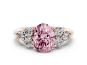 Fancy Pink Oval Cut Diamond Cluster Ring Set in Rose gold with Round Accent Stones and Prong Setting on a Plain Band