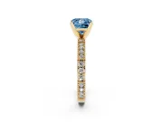 Fancy Blue Princess Cut Diamond Solitaire Ring Set in Yellow gold with Slim Pavé Band and Prong Setting