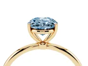 Fancy Blue Oval Cut Diamond Solitaire Engagement Ring Set in Yellow gold with Thin Band and Prong Setting