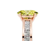Fancy Yellow Oval Cut Diamond Solitaire Ring Set in Rose gold with Channel-Set Band and Prong Setting