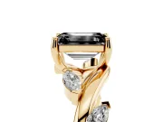 Fancy Black Emerald Cut Diamond Solitaire Ring Set in Yellow gold with Twisted Marquise Accent Band