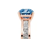 Fancy Blue Cushion Cut Diamond Solitaire Ring Set in Rose gold with Channel-Set Band and Prong Setting