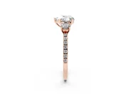 Heart Cut Diamond Three-Stone Ring Set in Rose gold with Pavé Band and Graduated Sides
