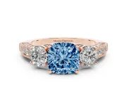 Fancy Blue Cushion Cut Diamond Three-Stone Ring Set in Rose gold with Round Side Stones and Pavé Band