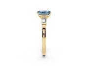 Fancy Blue Emerald Cut Diamond Solitaire Ring Set in Yellow gold with Tapered Baguette Accents and Prong Setting