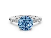 Fancy Blue Round Cut Diamond Solitaire Set in Platinum with Side Baguettes and Channel Set Band