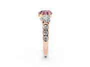 Fancy Pink Heart Cut Diamond Three-Stone Ring Set in Rose gold with Pavé Band