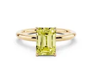Fancy Yellow Emerald Cut Diamond Solitaire Ring Set in Yellow gold with Thin Band and Prong Setting