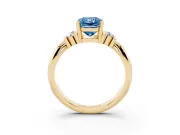 Fancy Blue Three-Stone Radiant Cut Diamond Channel Set Ring Set in Yellow gold with Bar Prongs
